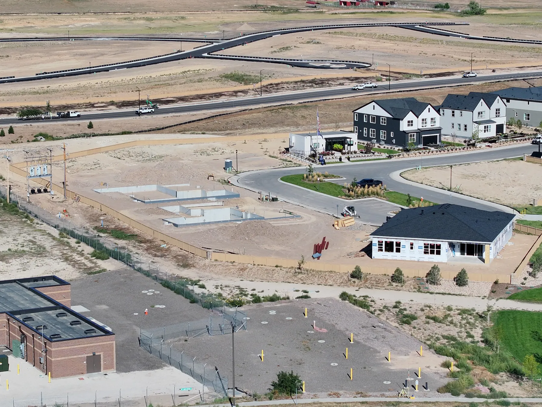 Aerial overview of a Northern Colorado construction site showing buildings and foundations