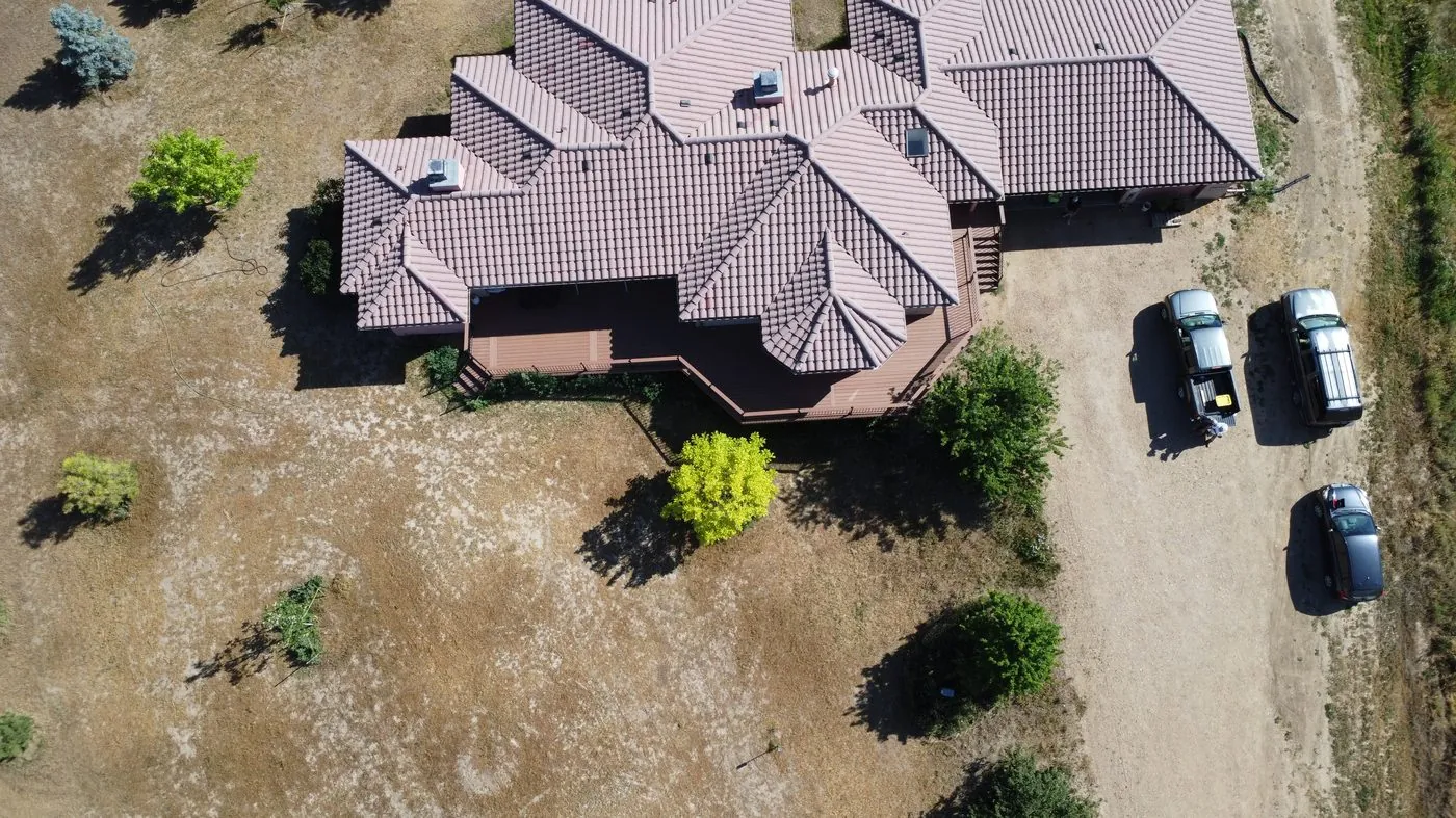 Top-down aerial of a tile-roof home
