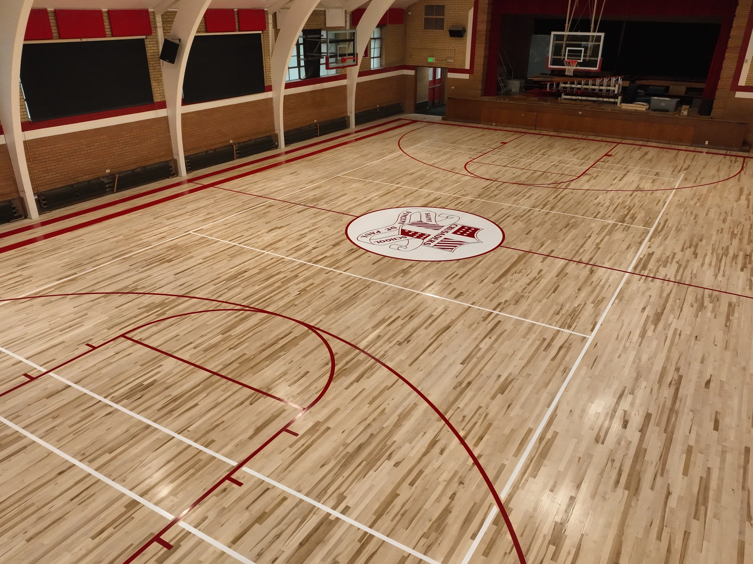 Wide oblique aerial view of the completed Saint Vincent de Paul School gymnasium court