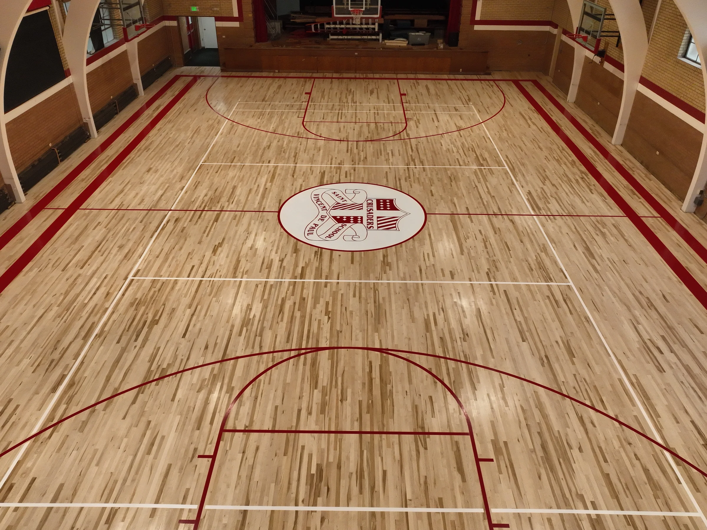 Centered elevated view showing almost the entire completed gymnasium court