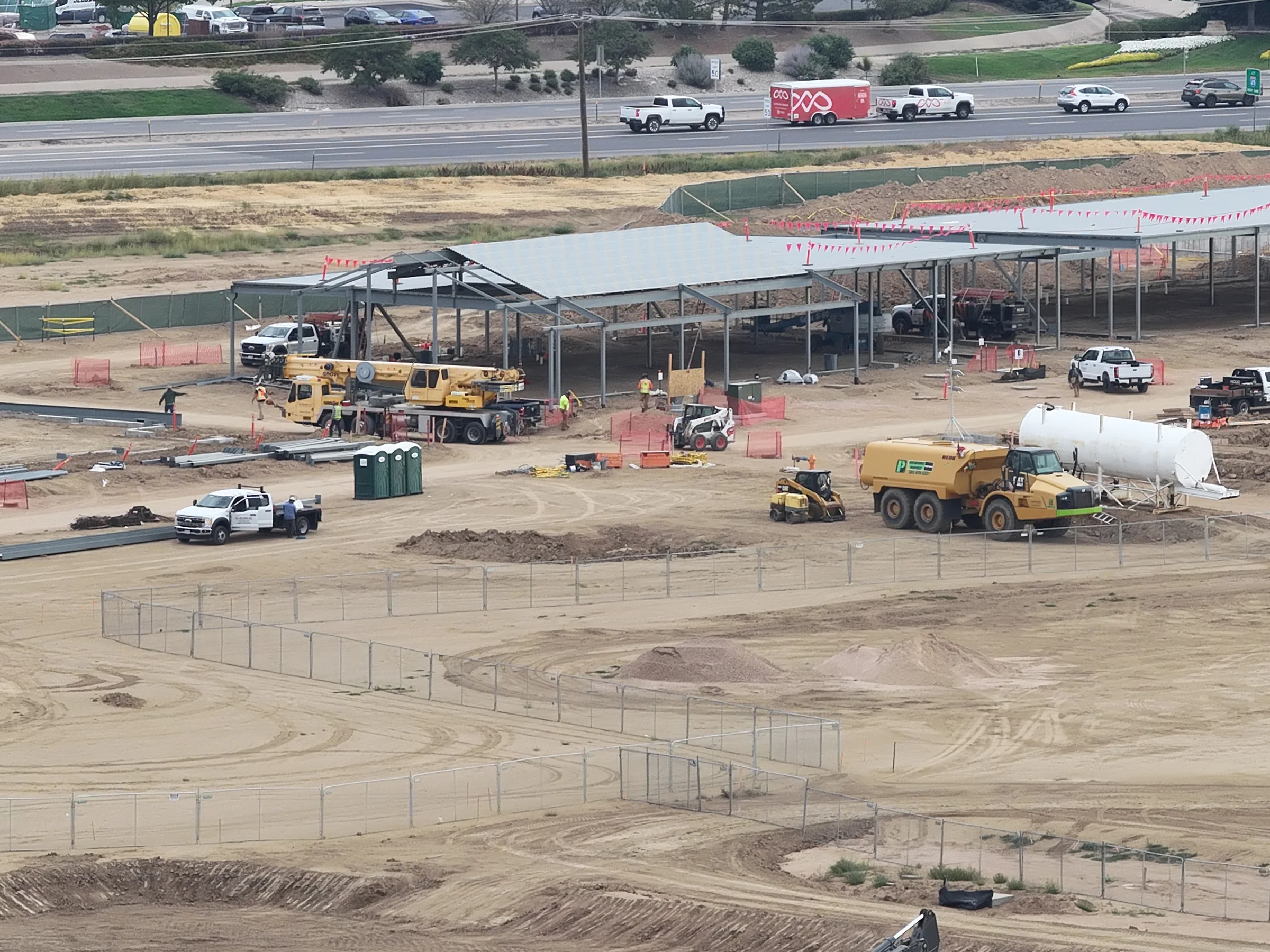 September 15 closer aerial view of steel framing, roof, crews and equipment