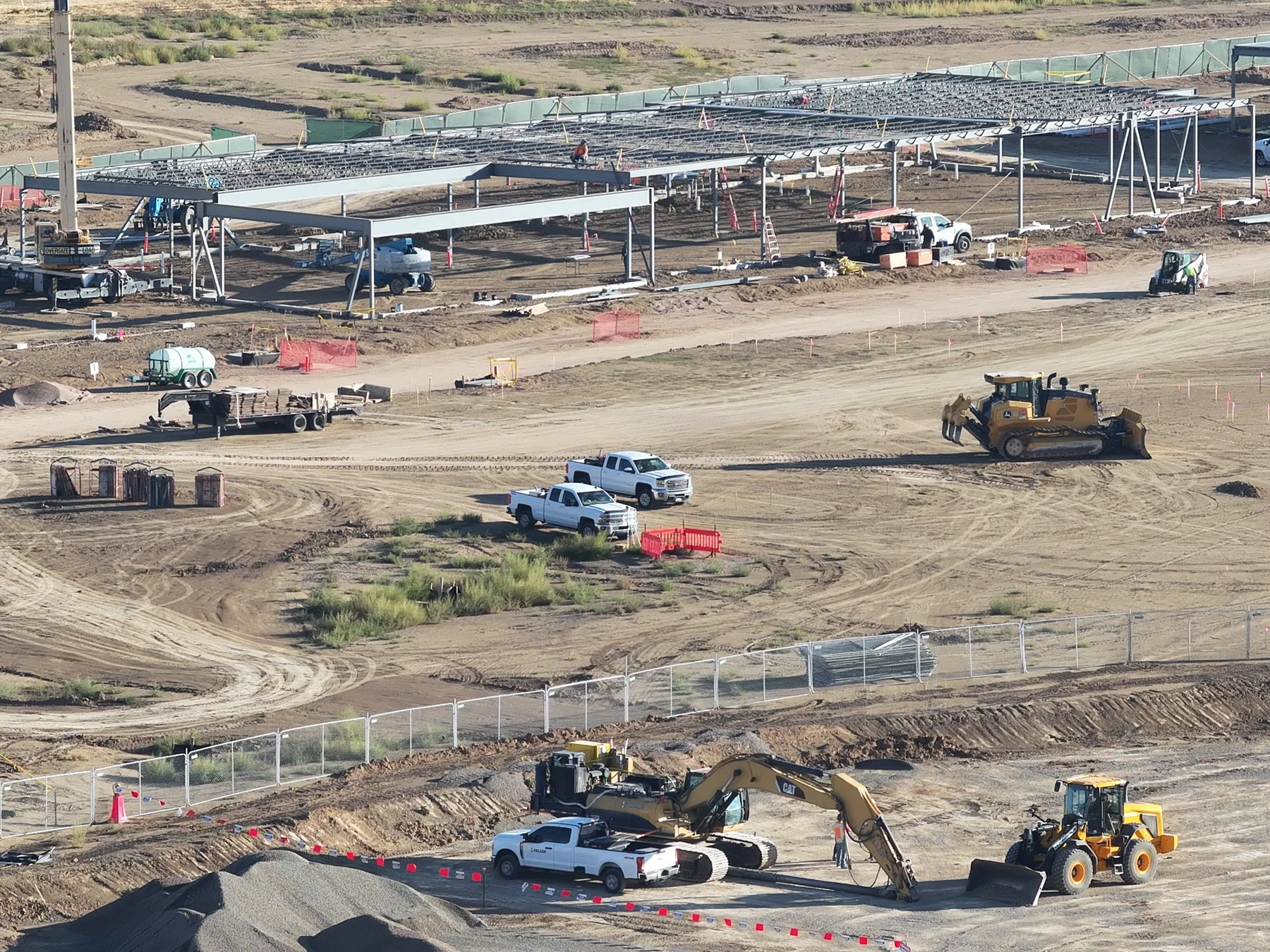 September 22 aerial view of earthmoving equipment, excavation and steel structures within the active work area